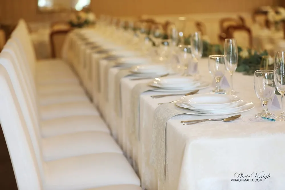 Long wedding table set with glassware