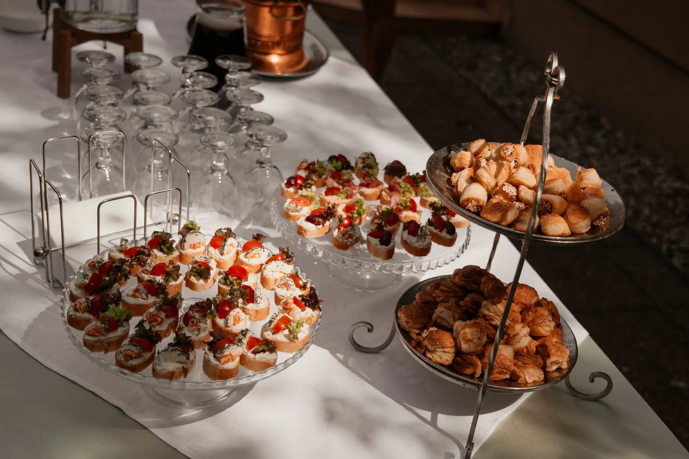 Savoury pastries and canapés on a tiered stand