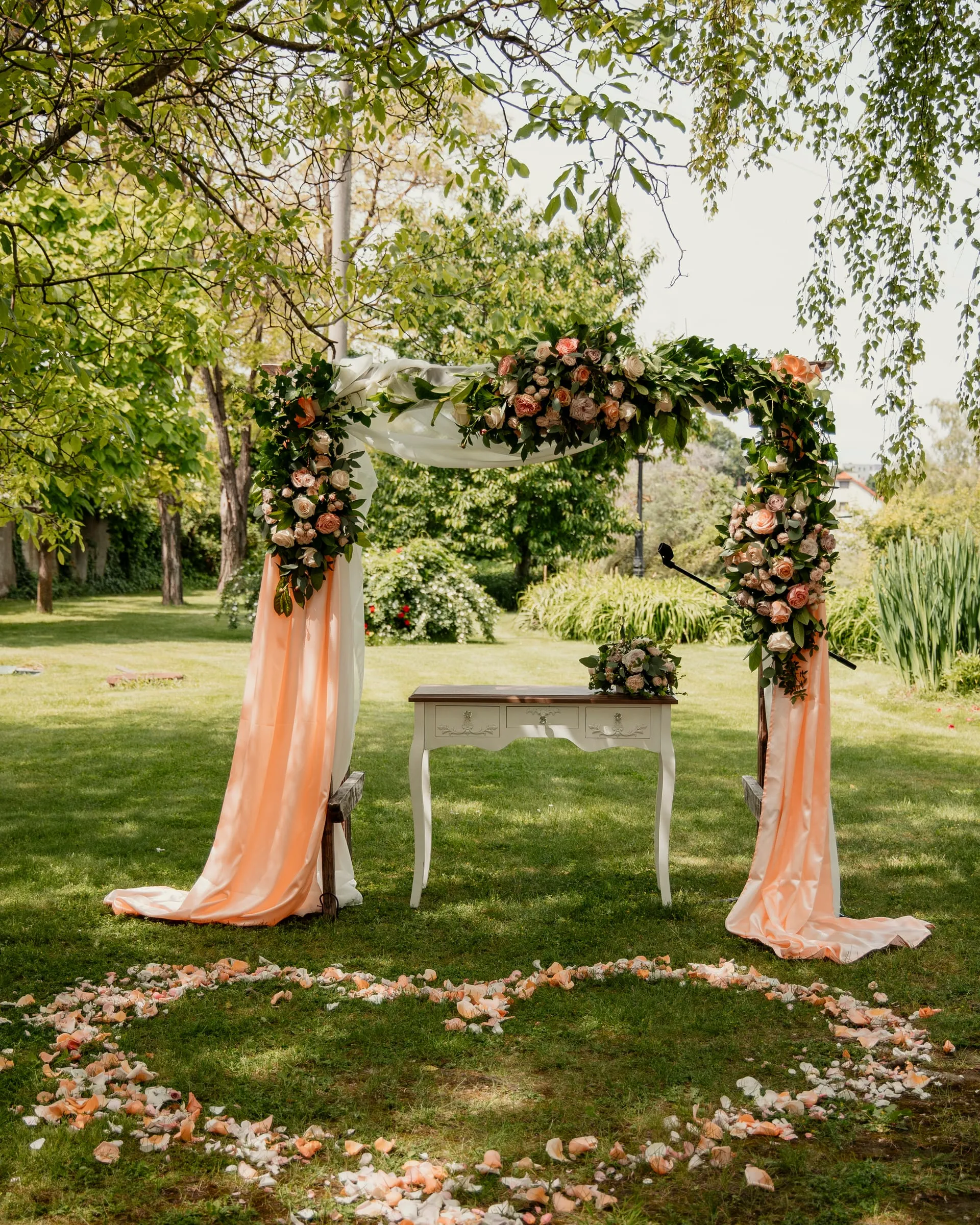 Floral arch and ceremony table in the park