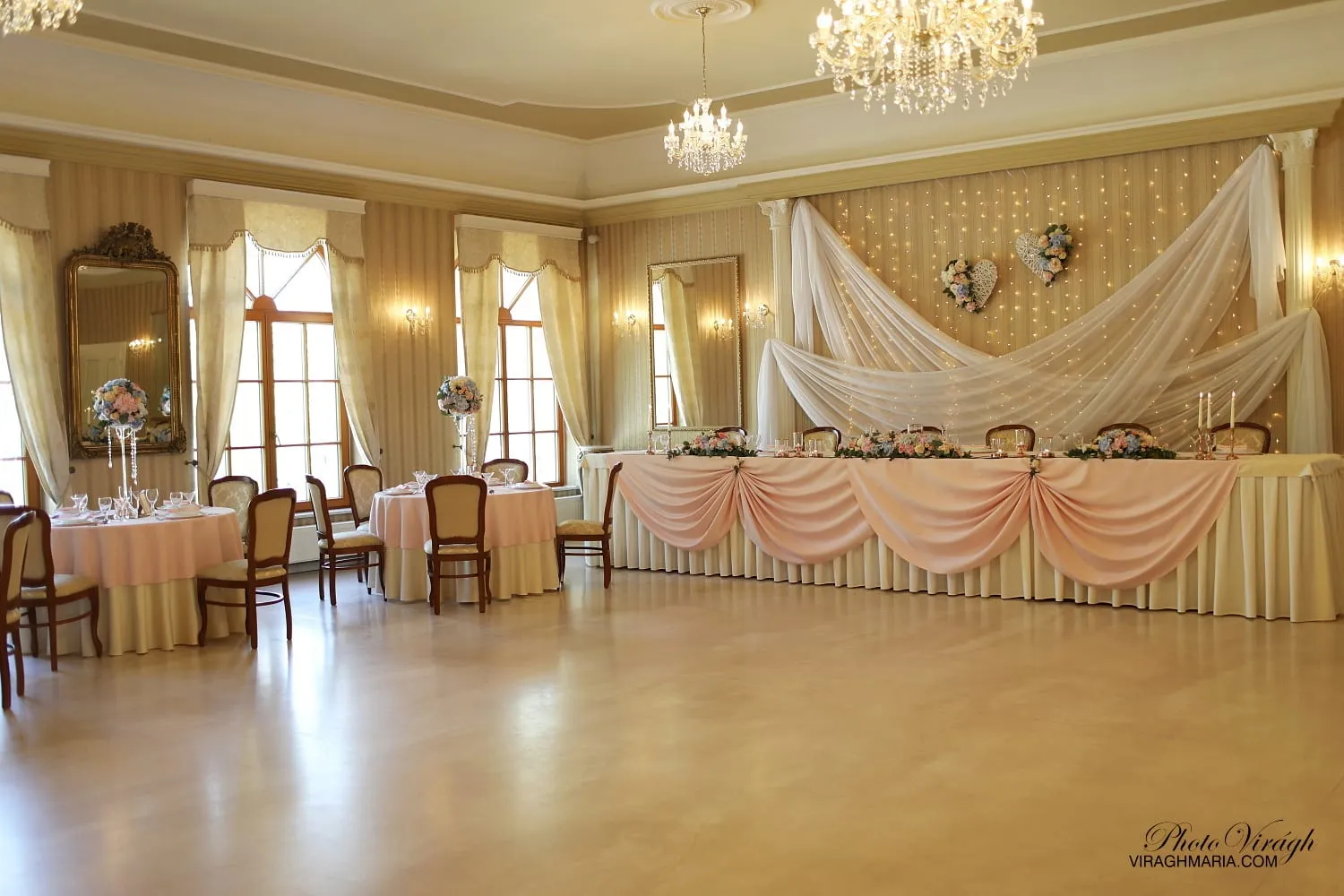 Banquet hall with a dance floor and chandeliers